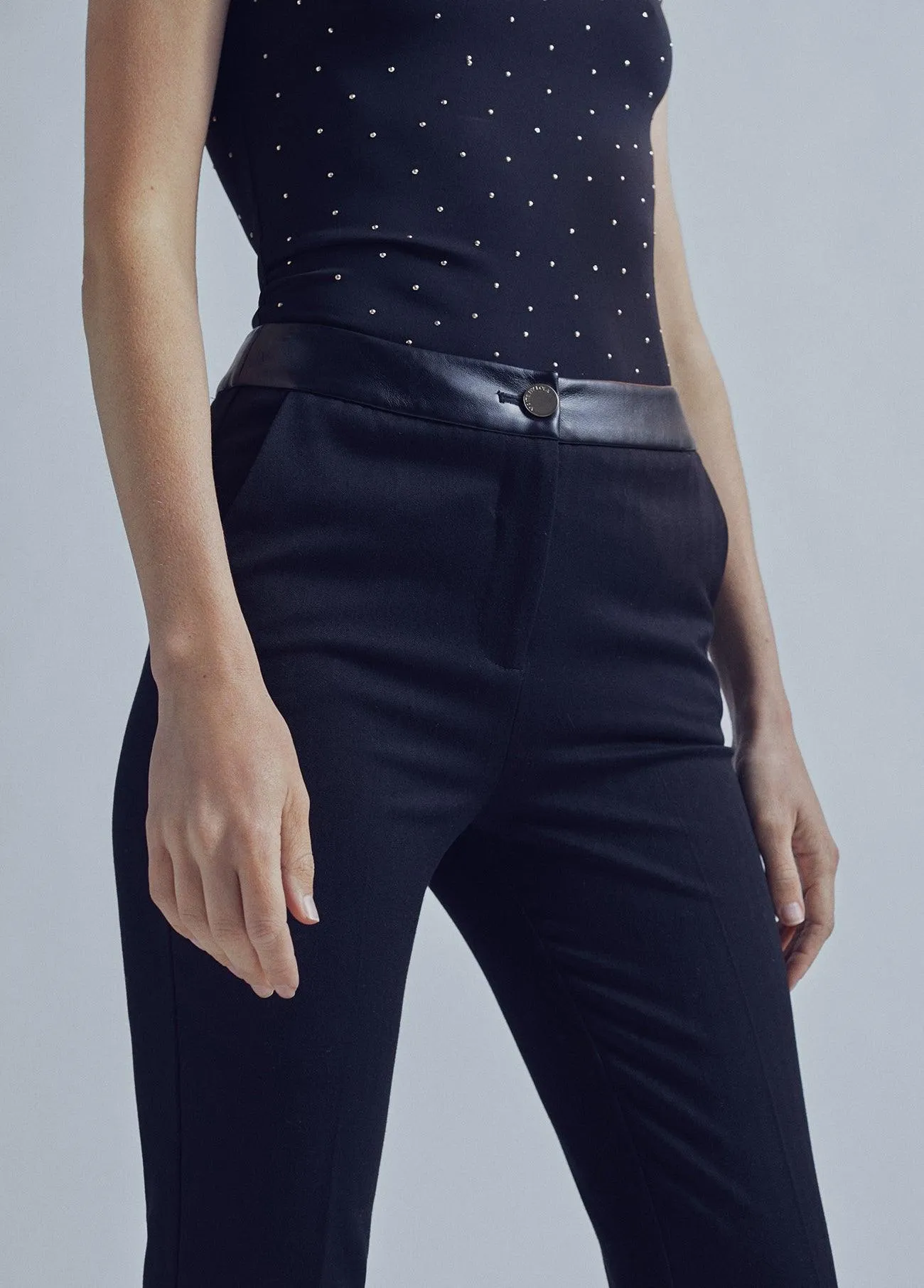 Flared trousers with leather detail